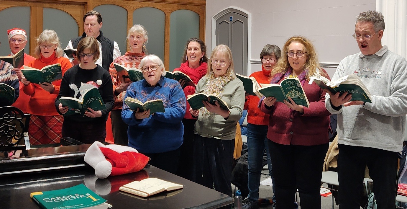 FCC carol singers preparing for a performance